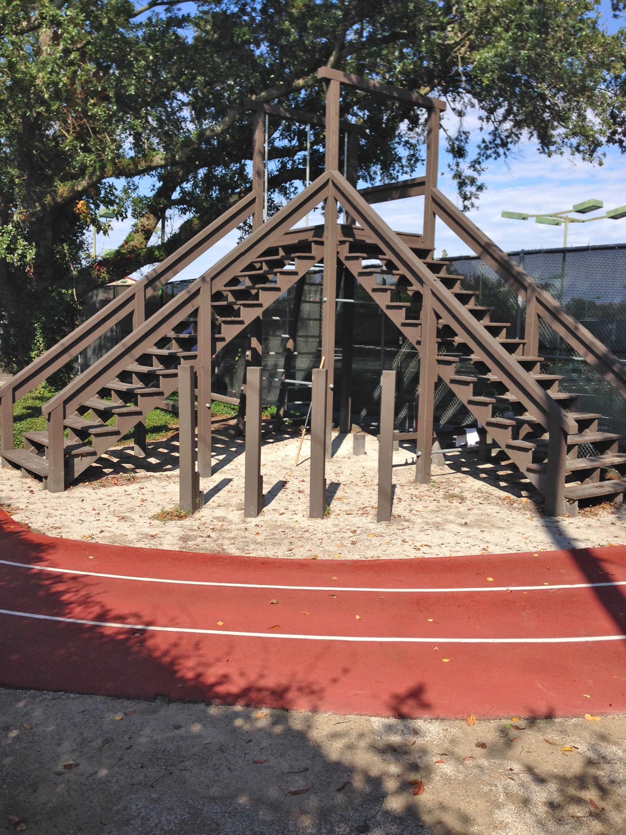 Boot camp climbing obstacle around the outdoor jogging track at Red's in Lafayette, La