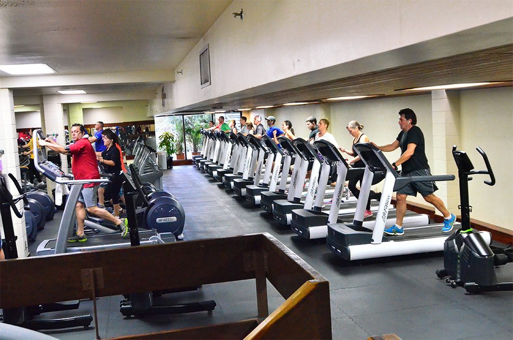Cardiovascular fitness equipment in crowded room at Red's in Lafayette, LA.