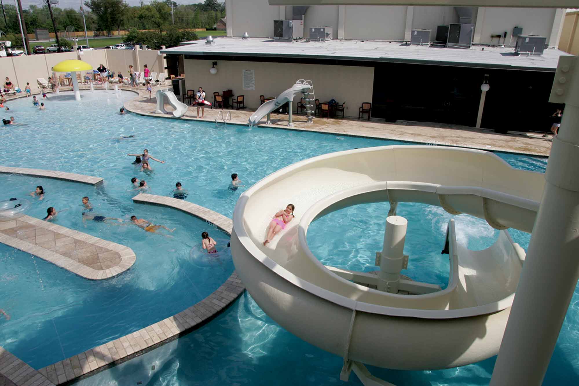 View of water slide, kids pool and lazy river at Red's in Lafayette, LA.