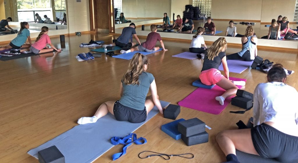 Youth athletic stretch class at Red's.